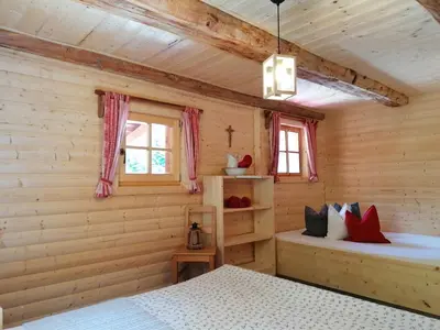 Ein Bett oder Betten in einem Zimmer der Unterkunft Ampferkaralm Hütte