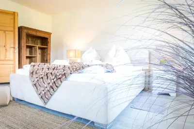 Ein Bett oder Betten in einem Zimmer der Unterkunft Chalet Wiesengut all famous ski areas around us, 10 min to salzburg, mountainview