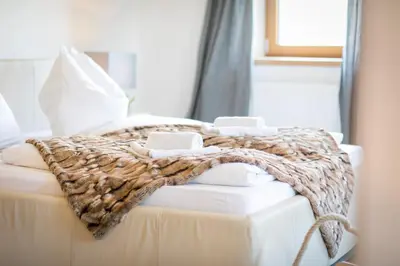 Ein Bett oder Betten in einem Zimmer der Unterkunft Chalet Wiesengut all famous ski areas around us, 10 min to salzburg, mountainview