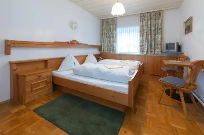 Ein Bett oder Betten in einem Zimmer der Unterkunft Tirolerhof