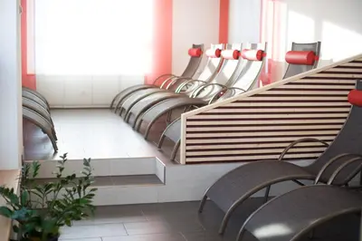 Ein Sitzbereich in der Unterkunft Hotel Hierzegger