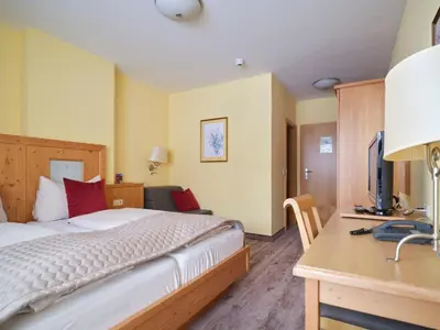 Ein Bett oder Betten in einem Zimmer der Unterkunft Hotel Hierzegger