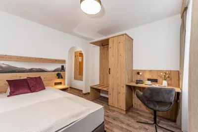Ein Bett oder Betten in einem Zimmer der Unterkunft Hotel Hierzegger