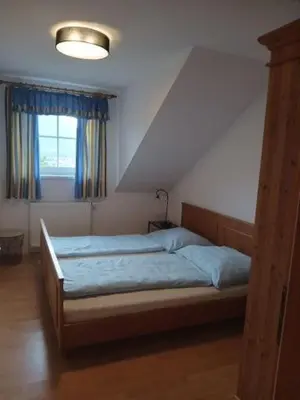 Ein Bett oder Betten in einem Zimmer der Unterkunft Dirnbergerhof
