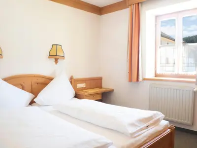 Ein Bett oder Betten in einem Zimmer der Unterkunft Gasthof zum Gellnwirt