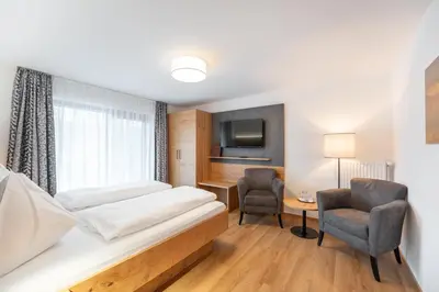Ein Bett oder Betten in einem Zimmer der Unterkunft Gasthof Hotel Andlwirt