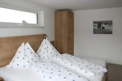 Ein Bett oder Betten in einem Zimmer der Unterkunft Haus Bergliebe