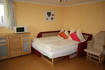 Ein Bett oder Betten in einem Zimmer der Unterkunft Haus Bergliebe