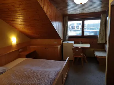 Ein Bett oder Betten in einem Zimmer der Unterkunft Hotel Wirt Z'Minsta