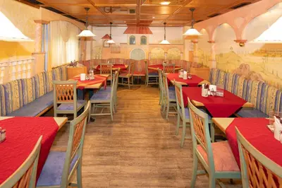 Ein Restaurant oder anderes Speiselokal in der Unterkunft Hotel Wirt Z'Minsta
