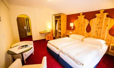 Ein Bett oder Betten in einem Zimmer der Unterkunft Hotel Enzian by Alpeffect Hotels