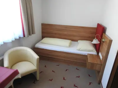 Ein Bett oder Betten in einem Zimmer der Unterkunft Hotel Moawirt