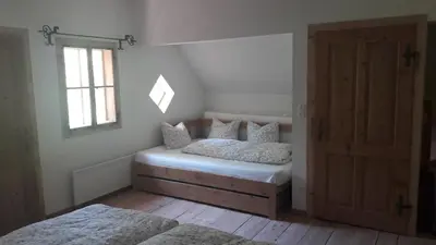 Ein Bett oder Betten in einem Zimmer der Unterkunft Plötzhof