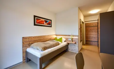 Ein Bett oder Betten in einem Zimmer der Unterkunft Huemer-Park Motel Vöcklatal