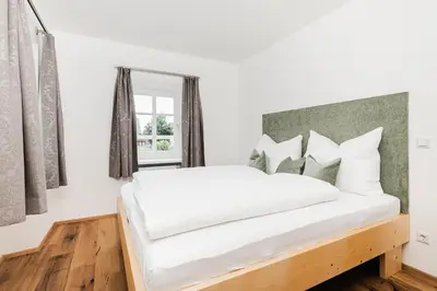 Ein Bett oder Betten in einem Zimmer der Unterkunft Tini´s Feinstes