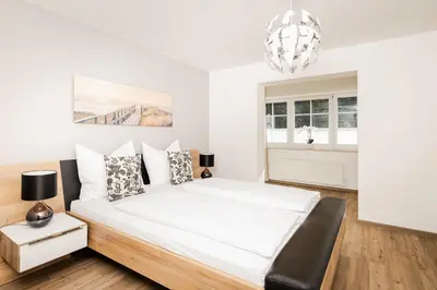Ein Bett oder Betten in einem Zimmer der Unterkunft Leonhardsblick Appartements