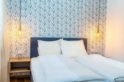 Ein Bett oder Betten in einem Zimmer der Unterkunft Kaminzimmer Suite