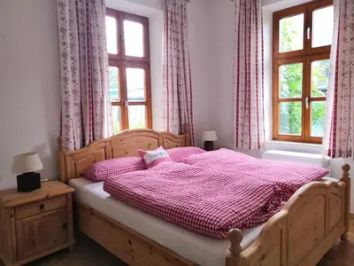 Ein Bett oder Betten in einem Zimmer der Unterkunft Ferienappartment zum grünen Hirsch