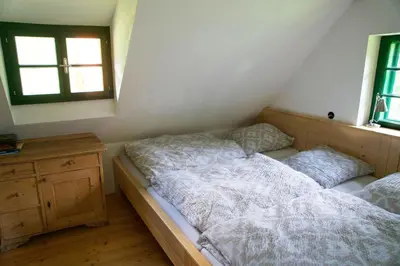 Ein Bett oder Betten in einem Zimmer der Unterkunft STEYR RIVER LODGE