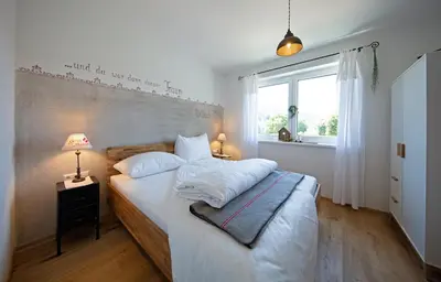 Ein Bett oder Betten in einem Zimmer der Unterkunft Ferienwohnungen Waltraud Trinker, Haus