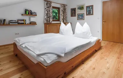 Ein Bett oder Betten in einem Zimmer der Unterkunft Ferienwohnung am Bründlweg