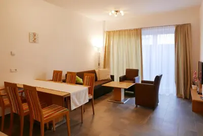 Ein Sitzbereich in der Unterkunft Deluxe Apartment SCHRABERGER