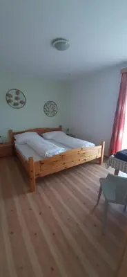 Ein Bett oder Betten in einem Zimmer der Unterkunft Fruhstuckspension Bischof i d Wiesen