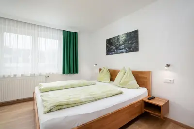 Ein Bett oder Betten in einem Zimmer der Unterkunft Apartments Frauenschuh