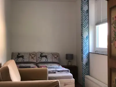 Ein Bett oder Betten in einem Zimmer der Unterkunft Grüner Baum ferienwohnung