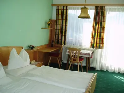 Ein Bett oder Betten in einem Zimmer der Unterkunft Ausflugshotel Huttersberg