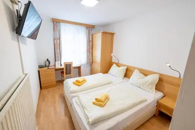 Ein Bett oder Betten in einem Zimmer der Unterkunft Gästehaus Leypold