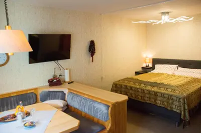 Ein Bett oder Betten in einem Zimmer der Unterkunft Apartment 12 Grüner Baum Alpendorf