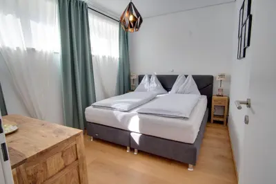 Ein Bett oder Betten in einem Zimmer der Unterkunft Ferienwohnung Angerer
