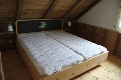 Ein Bett oder Betten in einem Zimmer der Unterkunft Almchalet Feuerkogel
