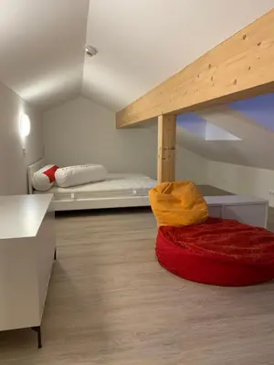 Ein Bett oder Betten in einem Zimmer der Unterkunft Alpenlodge Haus im Ennstal