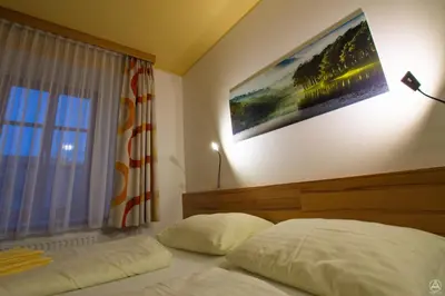 Ein Bett oder Betten in einem Zimmer der Unterkunft Egidiwirt Murau