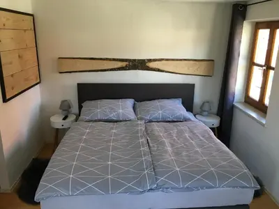 Ein Bett oder Betten in einem Zimmer der Unterkunft Ferienwohnung Radauer