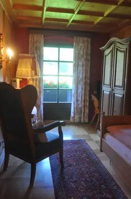 Ein Bett oder Betten in einem Zimmer der Unterkunft Romantikhotel Almtalhof