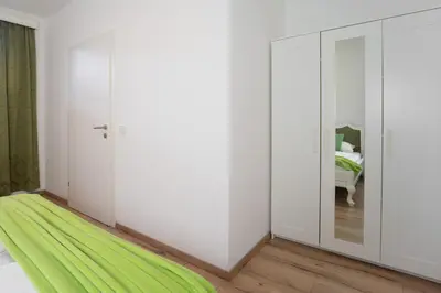 Ein Bett oder Betten in einem Zimmer der Unterkunft Dalila Appartements