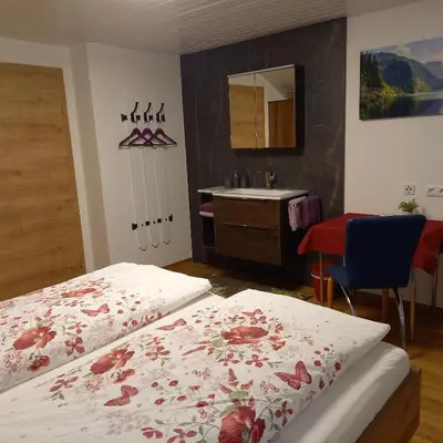 Ein Bett oder Betten in einem Zimmer der Unterkunft Gästehaus Sieglinde