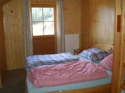 Ein Bett oder Betten in einem Zimmer der Unterkunft Almrauschhütte Markus