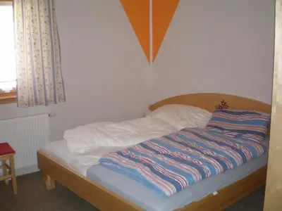 Ein Bett oder Betten in einem Zimmer der Unterkunft Almrauschhütte Markus