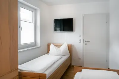 Ein Bett oder Betten in einem Zimmer der Unterkunft Terrassen-Appartement Held by Schladming-Appartements