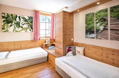 Ein Bett oder Betten in einem Zimmer der Unterkunft Fewo-Obertauern-Steinadler