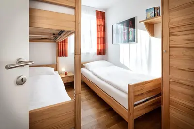 Ein Bett oder Betten in einem Zimmer der Unterkunft Fewo-Obertauern Alps