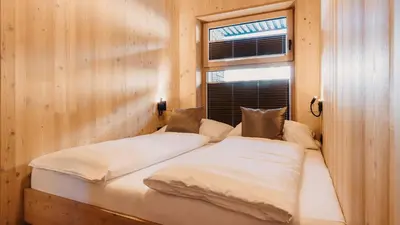 Ein Bett oder Betten in einem Zimmer der Unterkunft Hofgut Apartment & Lifestyle Resort Wagrain