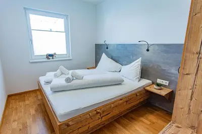 Ein Bett oder Betten in einem Zimmer der Unterkunft Happy Aich 3 by Alpenidyll Apartments