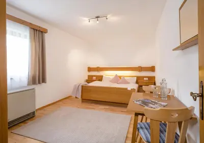 Ein Bett oder Betten in einem Zimmer der Unterkunft Appartements Klausner