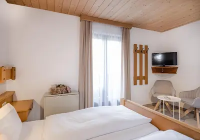 Ein Bett oder Betten in einem Zimmer der Unterkunft Appartements Klausner