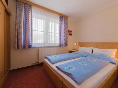 Ein Bett oder Betten in einem Zimmer der Unterkunft Haus Maier